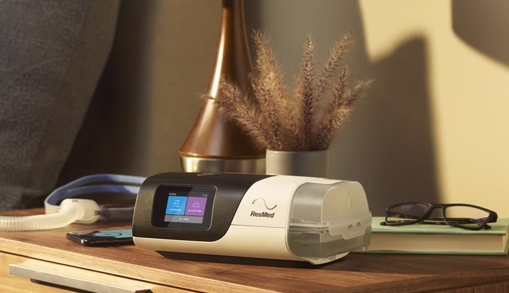 ResMed CPAP machine on a nightstand