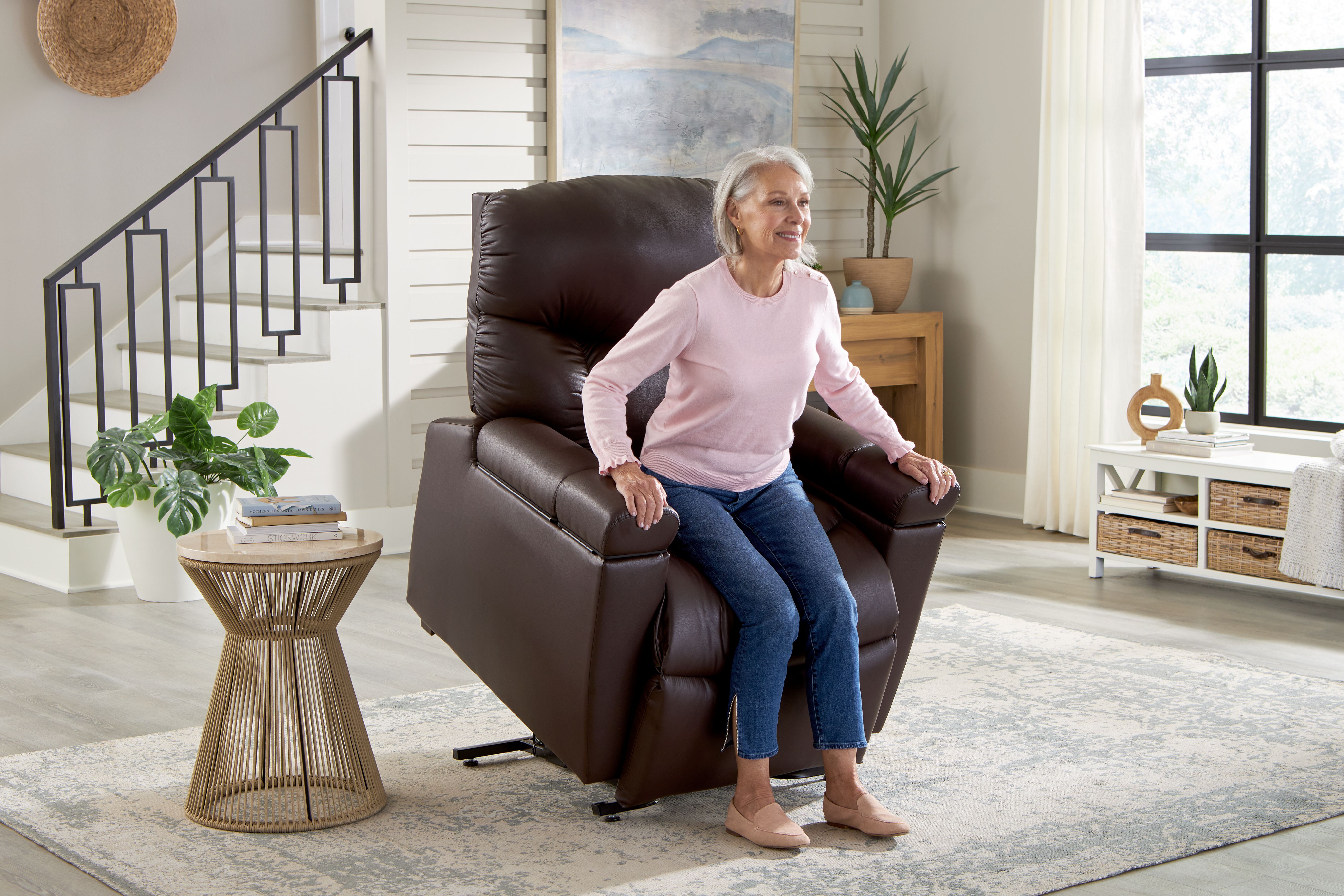 Woman rising from a Golden Technologies lift chair
